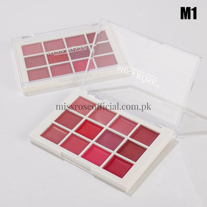 Makeup palette with various shades of pink and red on a white background